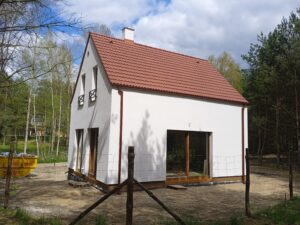 Firma budowlana Poznań - dom z użytkowym poddaszem i dachem dwuspadowym