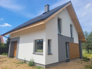 Firma budowlana Poznań - dom z użytkowym poddaszem i dachem dwuspadowym